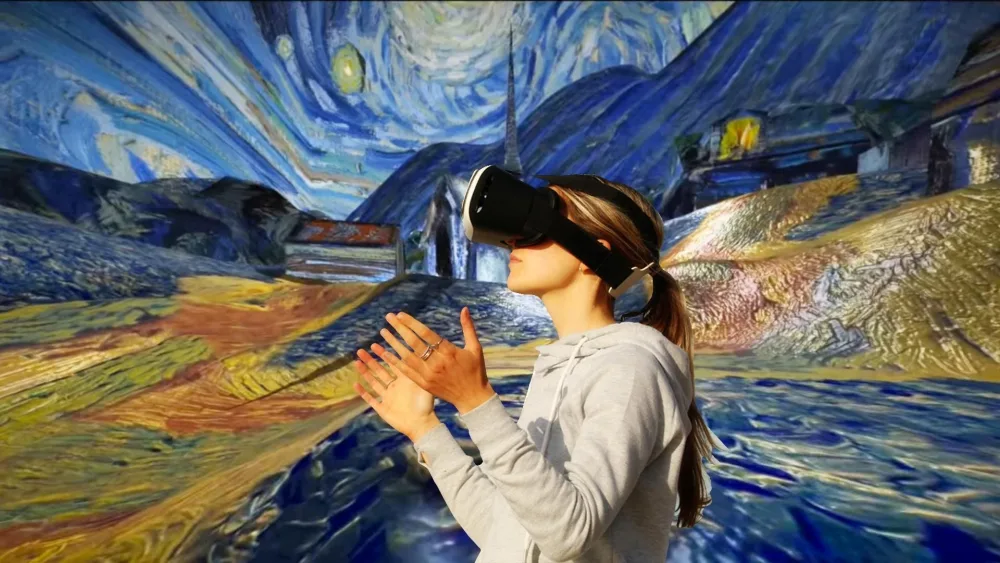 A visitor wearing a VR headset, composited into the Starry Night environment